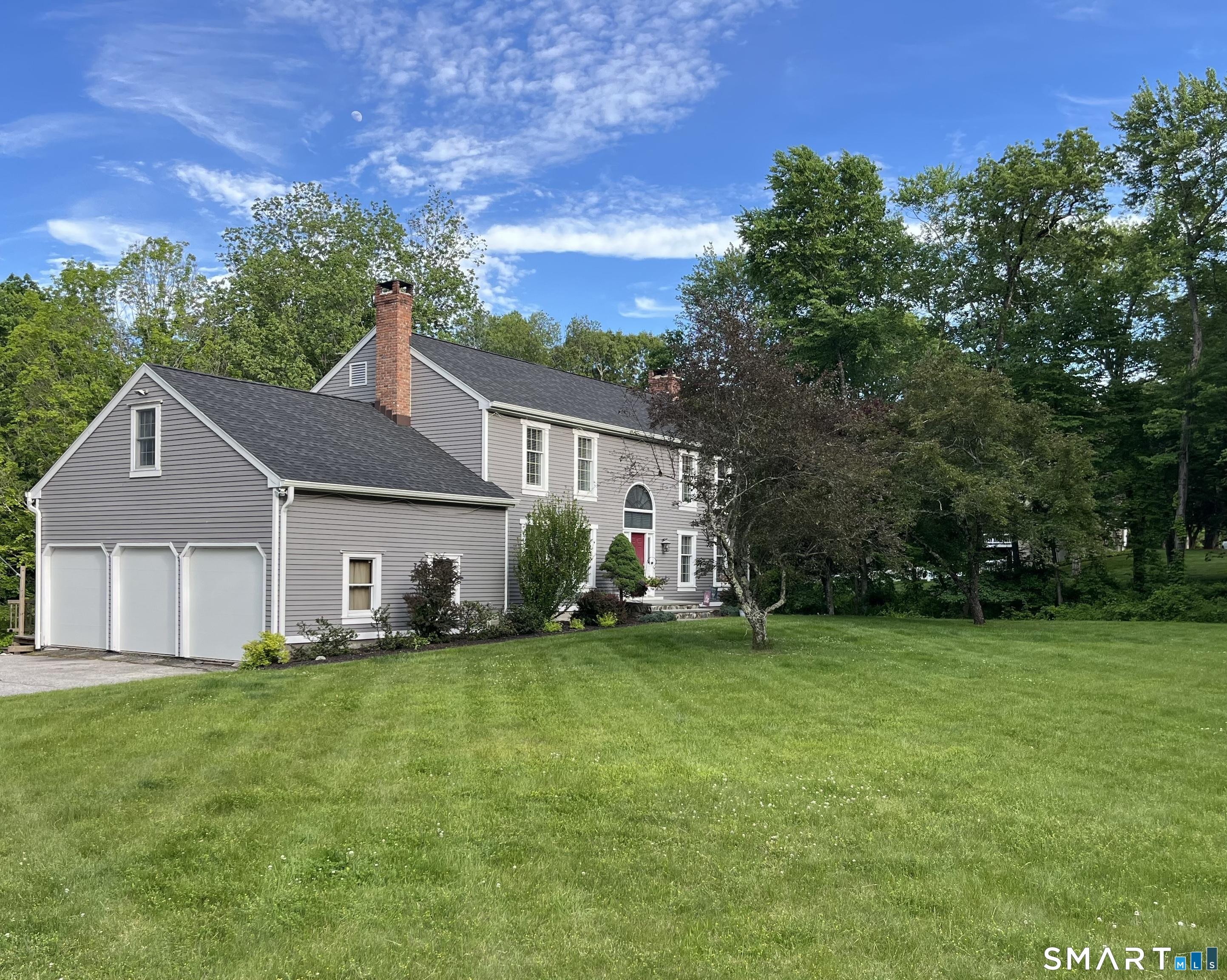 Image 2Garage: Massive 3 car garage with newer 8 foot high doors which are 9 feet wide. Inside you will find an over sized garage with 11 foot high ceilings which could accommodate many uses. 