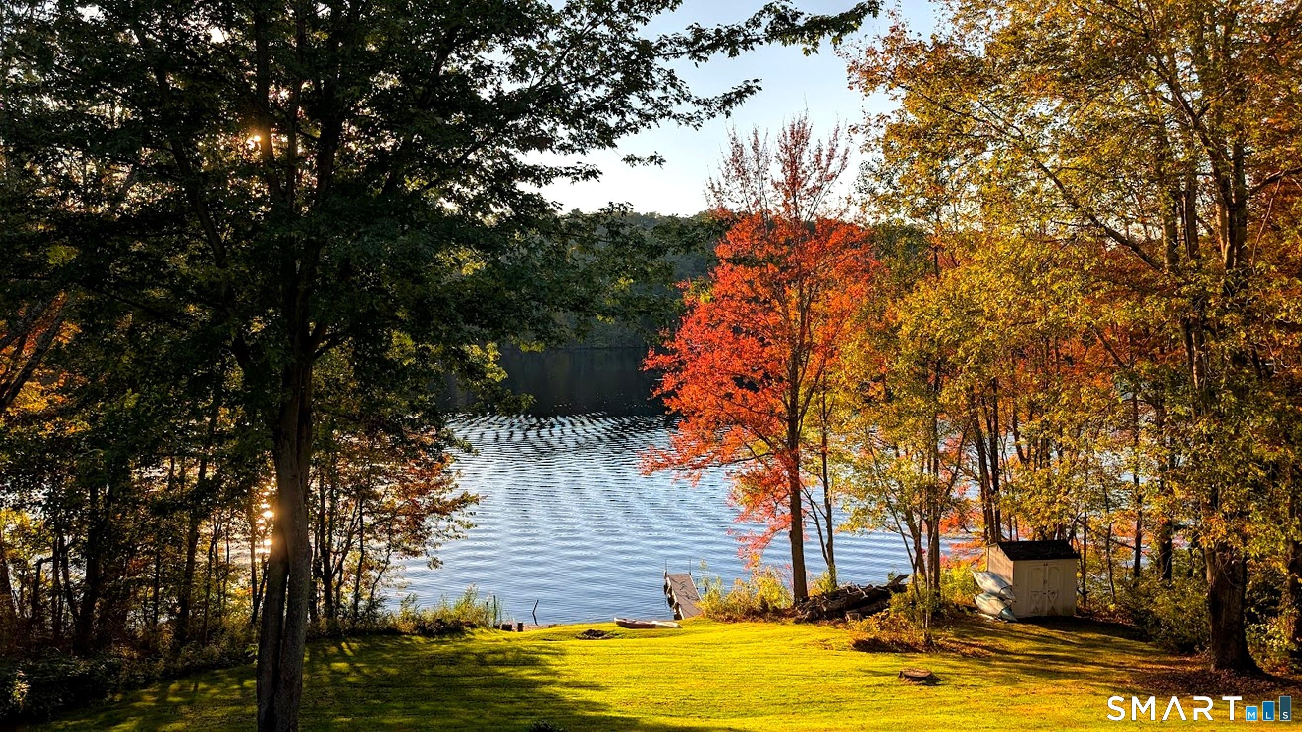 Image 2Waterfront: With prime western exposure and over 150 feet of direct waterfront, this property offers a rare opportunity to enjoy year-round living on one of Woodstock's most coveted lakes.