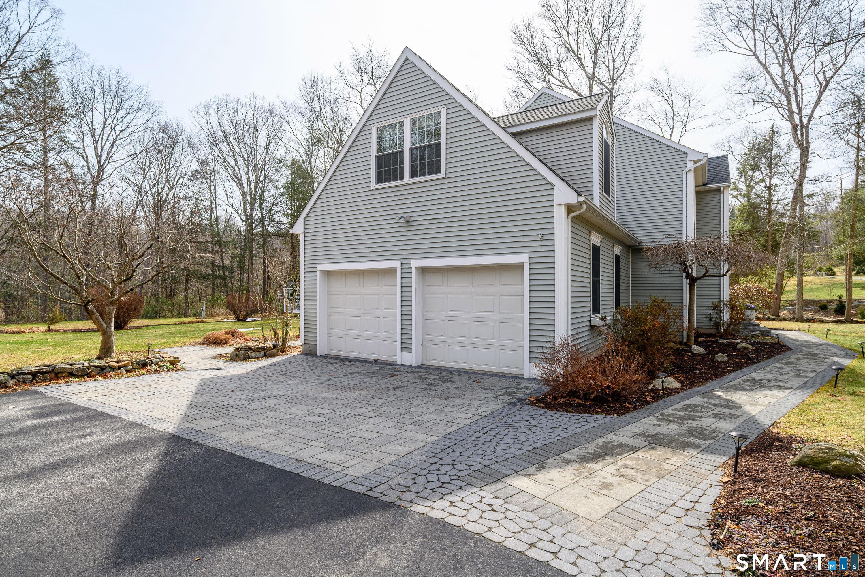 Image 3Garage: It's all in the detail! The stonework around the property from the driveway apron to the walkway to the backyard stone patio to the stone porch front and back, the grounds are unrivaled!