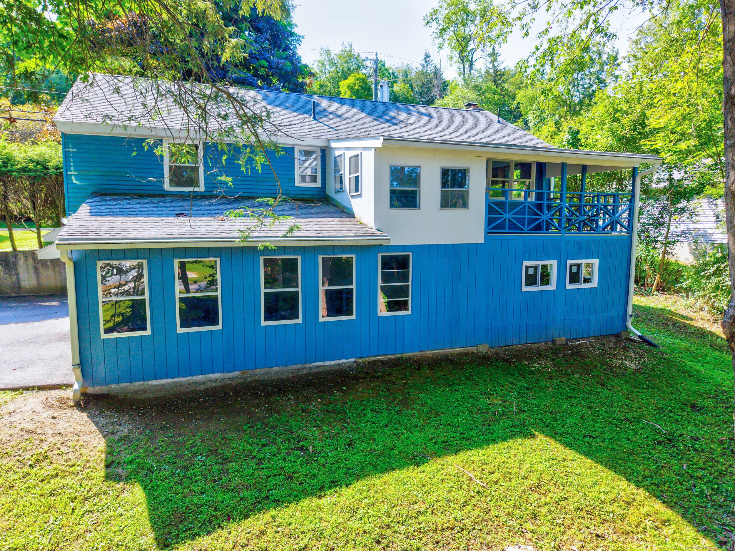 Image 3: Back of the house facing the backyard