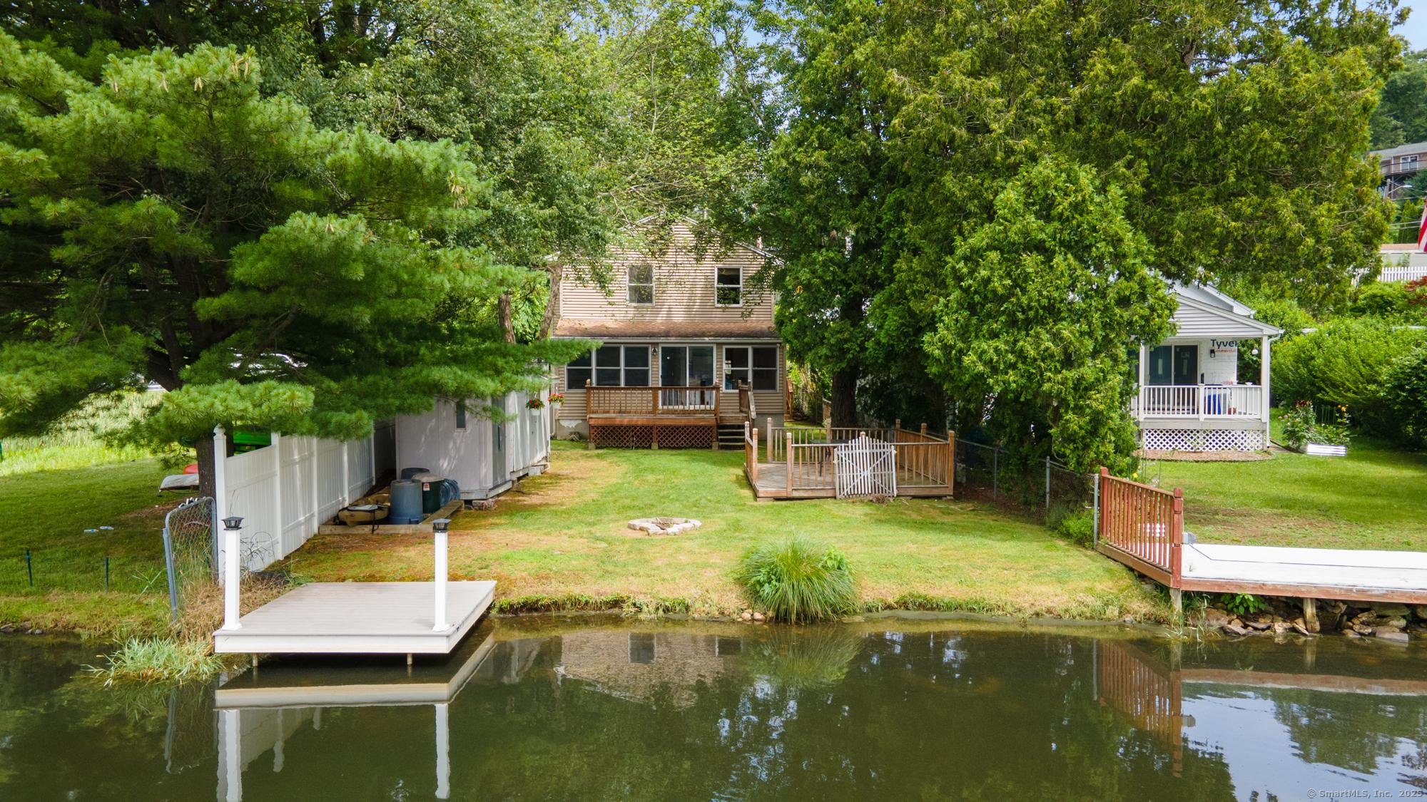 Image 2Back Yard: View of backyard and house from water
