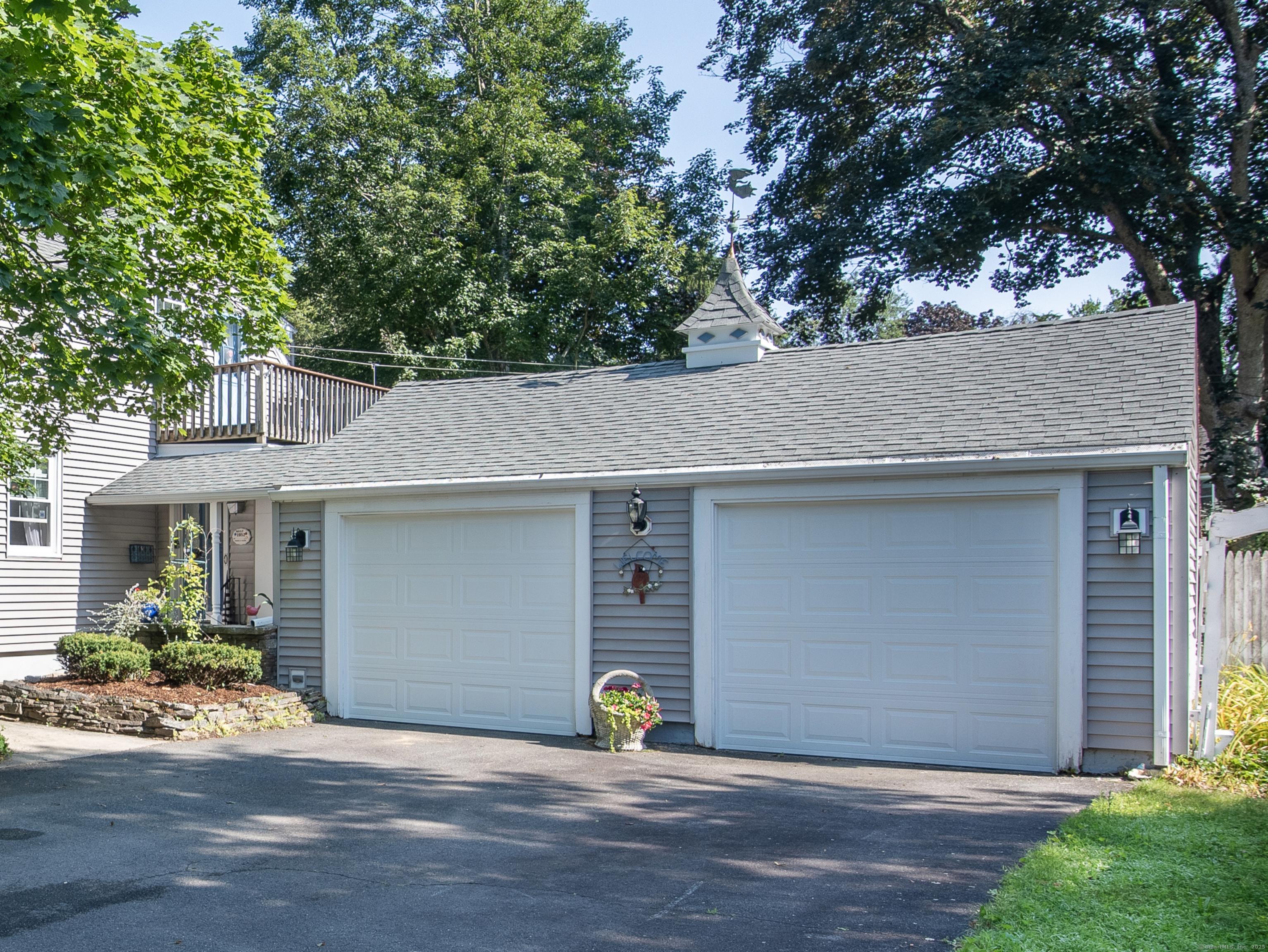 Image 3: Beautiful Two Car Garage with Loft Storage.