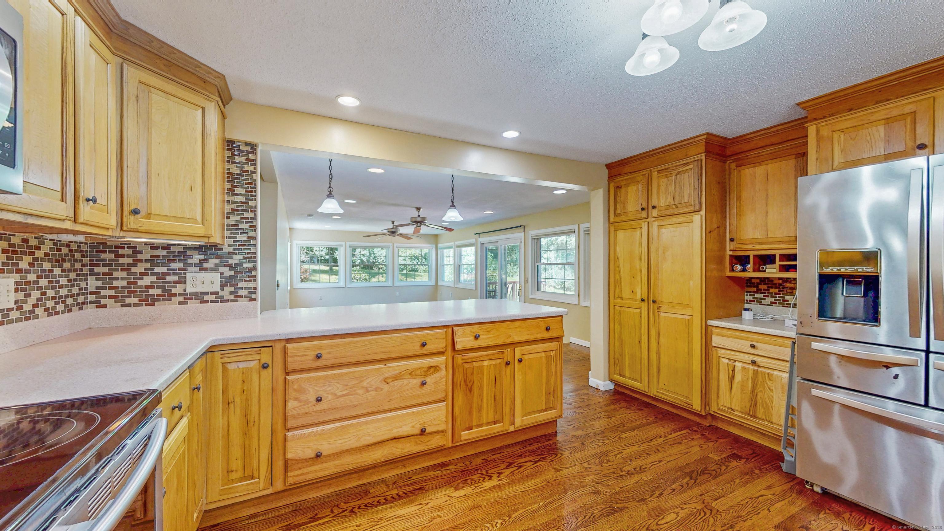 Image 4Kitchen: Gorgeous wood cabinetry for maximum storage.