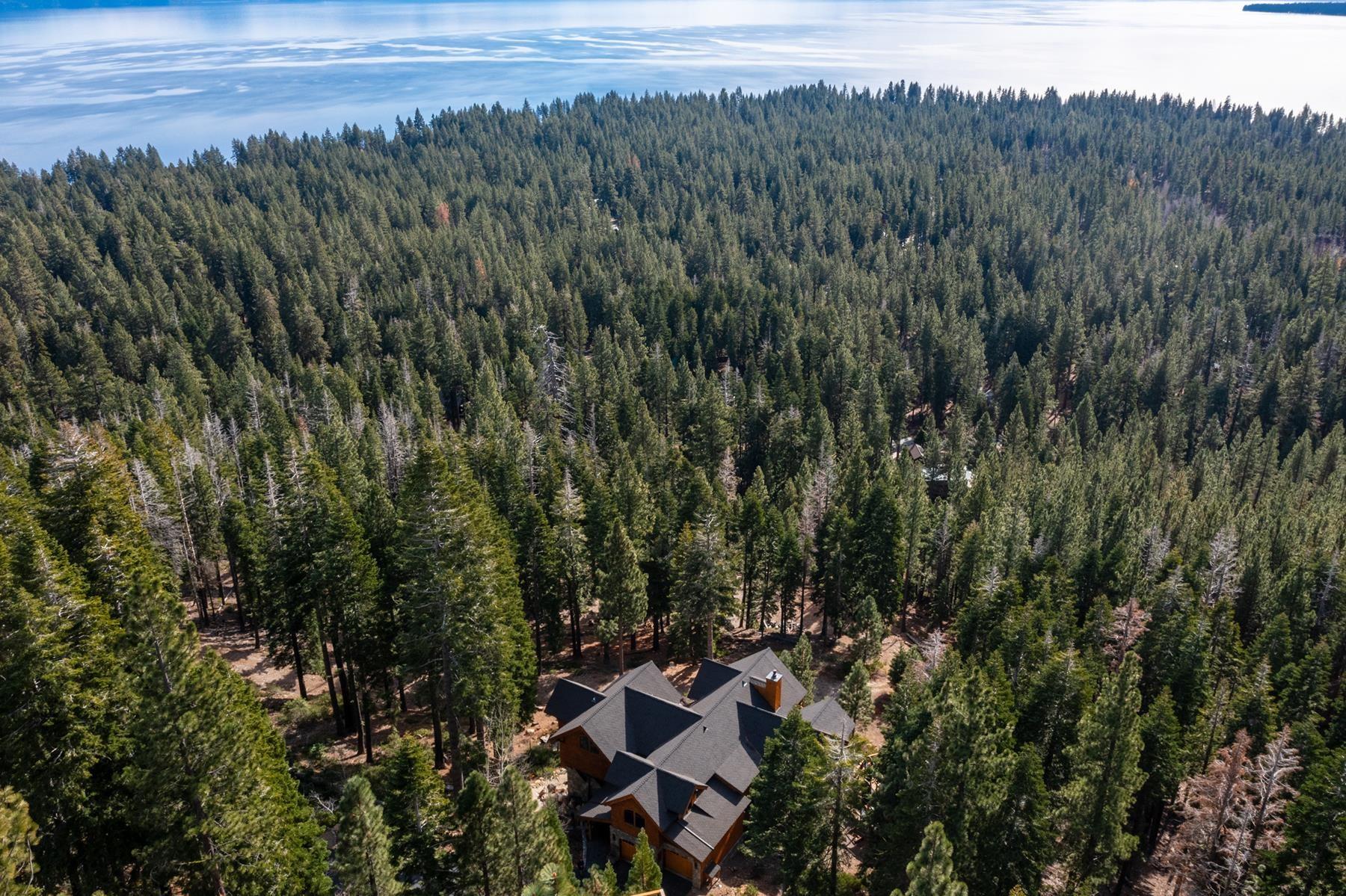 Image 0: The home is at top of the 13.6-acre parcel. Just beyond the acreage is the Tahoe Park neighborhood., Drone Photo