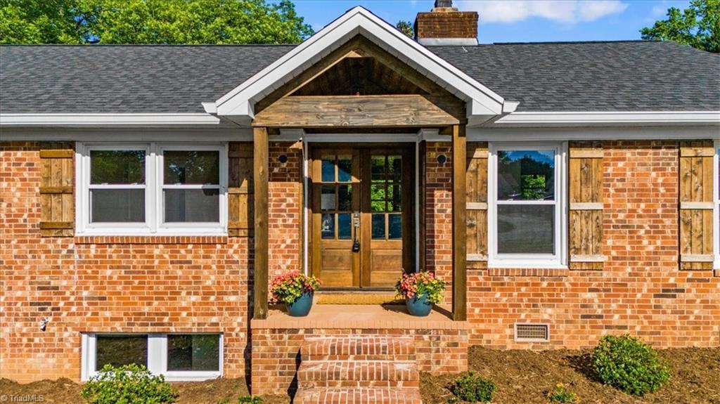 Image 2: Front Porch and double wood front doors