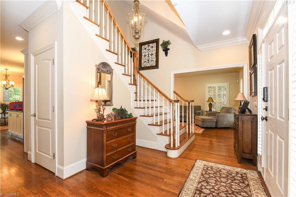 Image 2: Grand two story entry way with elegant staircase