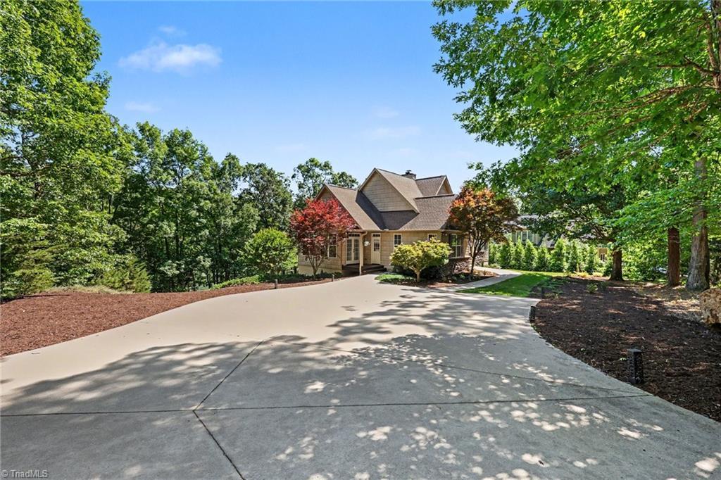 Image 3: Entryway to parking and side of home