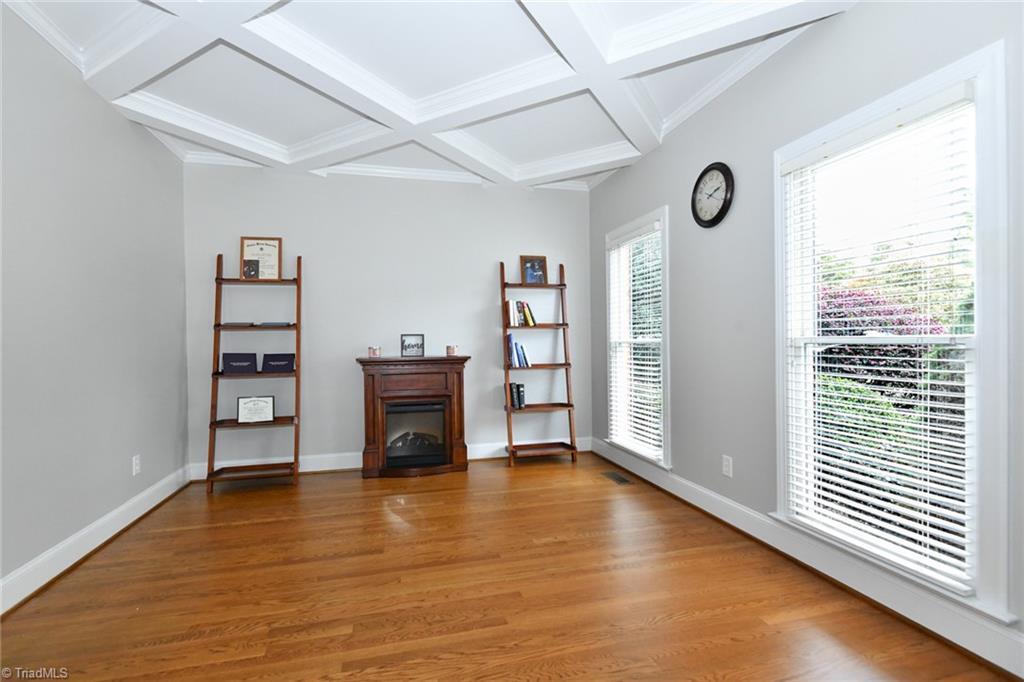 Image 4: Living room/Study with privacy doors and coffered ceiling.