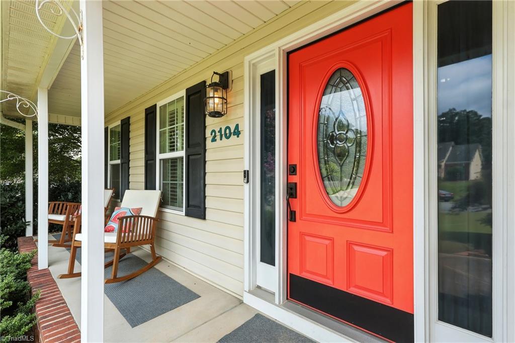 Image 2: Start your mornings with coffee or end your evenings with quiet talks on this inviting front porch.