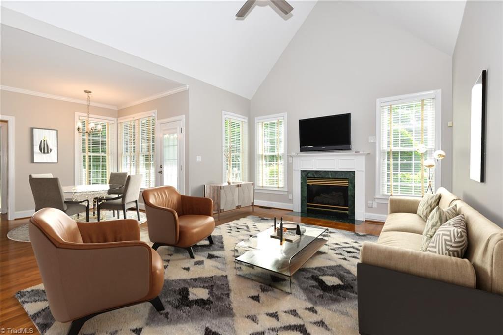 Image 4: Virtually staged.  Living room has loads of natural light!