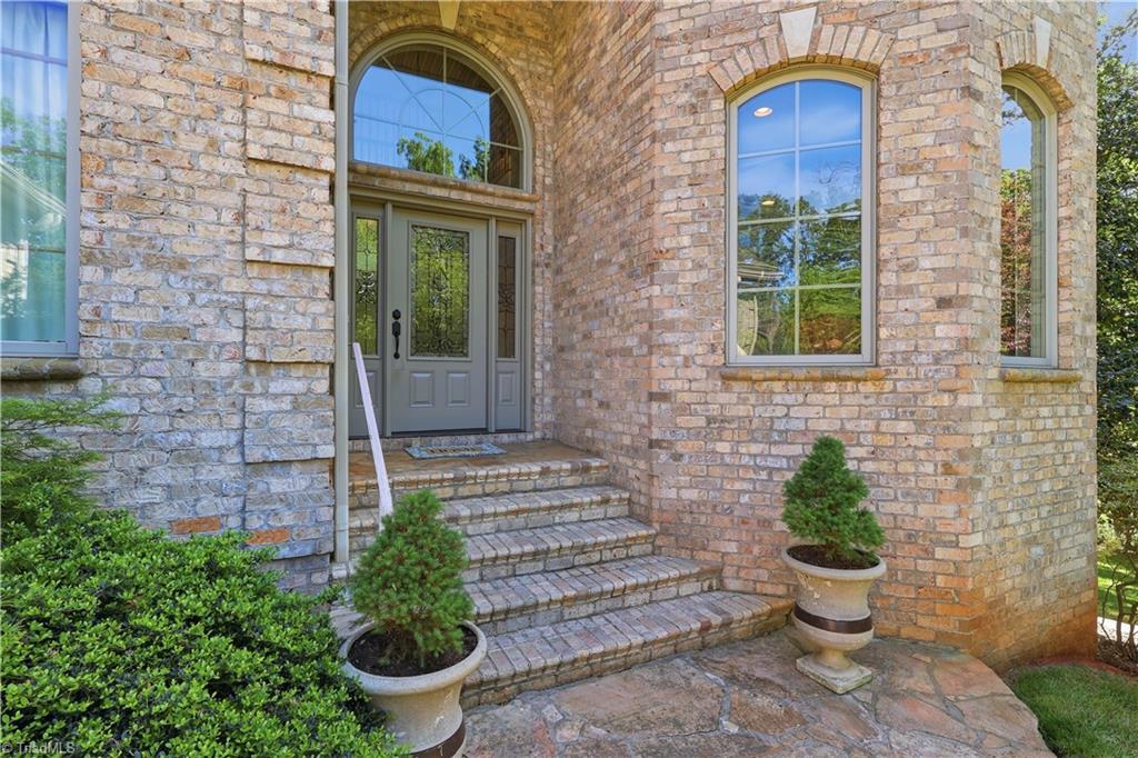 Image 4: Front Entry with Stone Walkway & Brick Steps