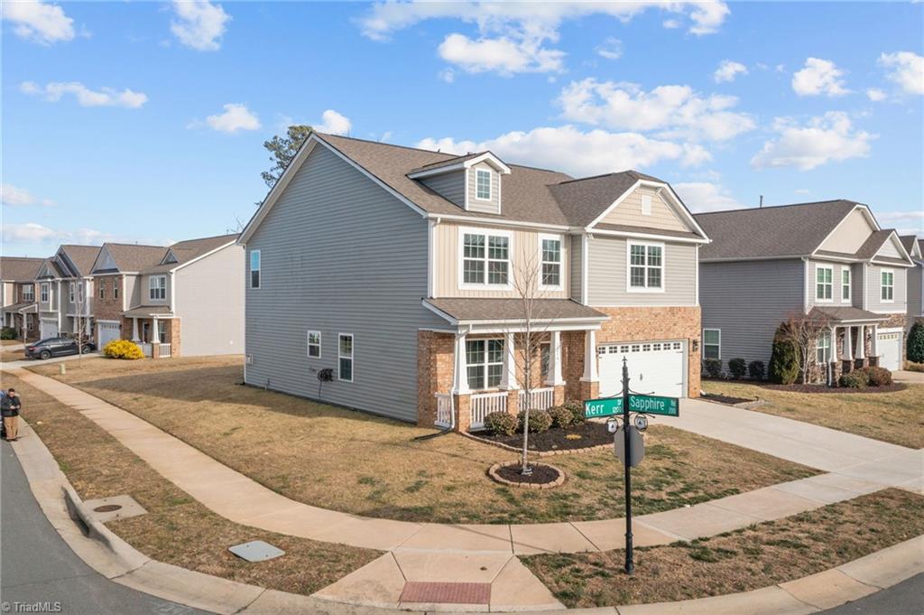 Image 1: Located on a desirable corner lot!