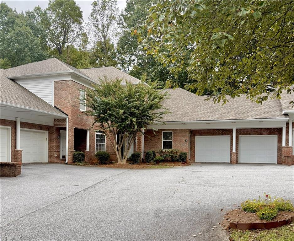 Image 2: Condo is a corner unit with 2 car garage