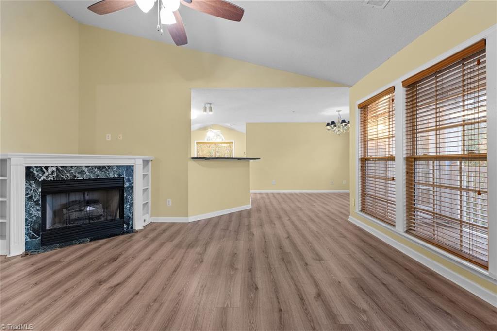 Image 4: View of living room with fireplace.