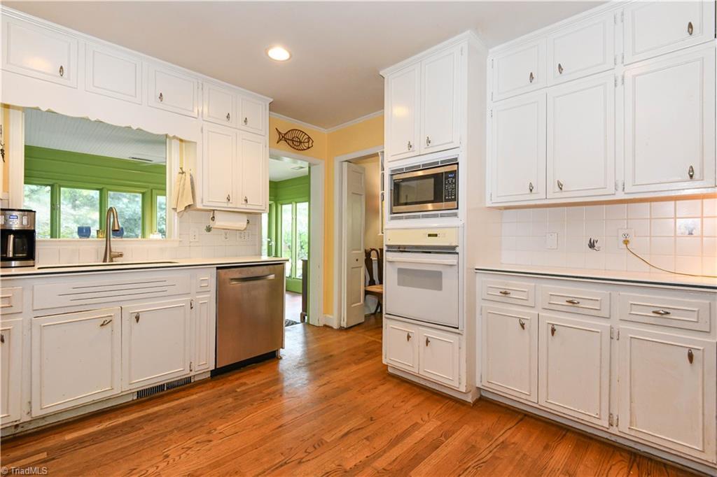 Image 3: Kitchen opens to Sunroom
