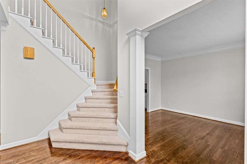 Image 3: Two story foyer; dual staircases