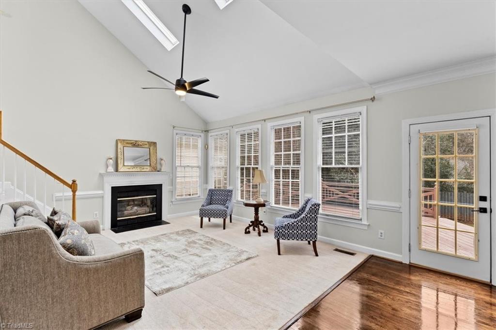 Image 4: Vaulted great room with skylights