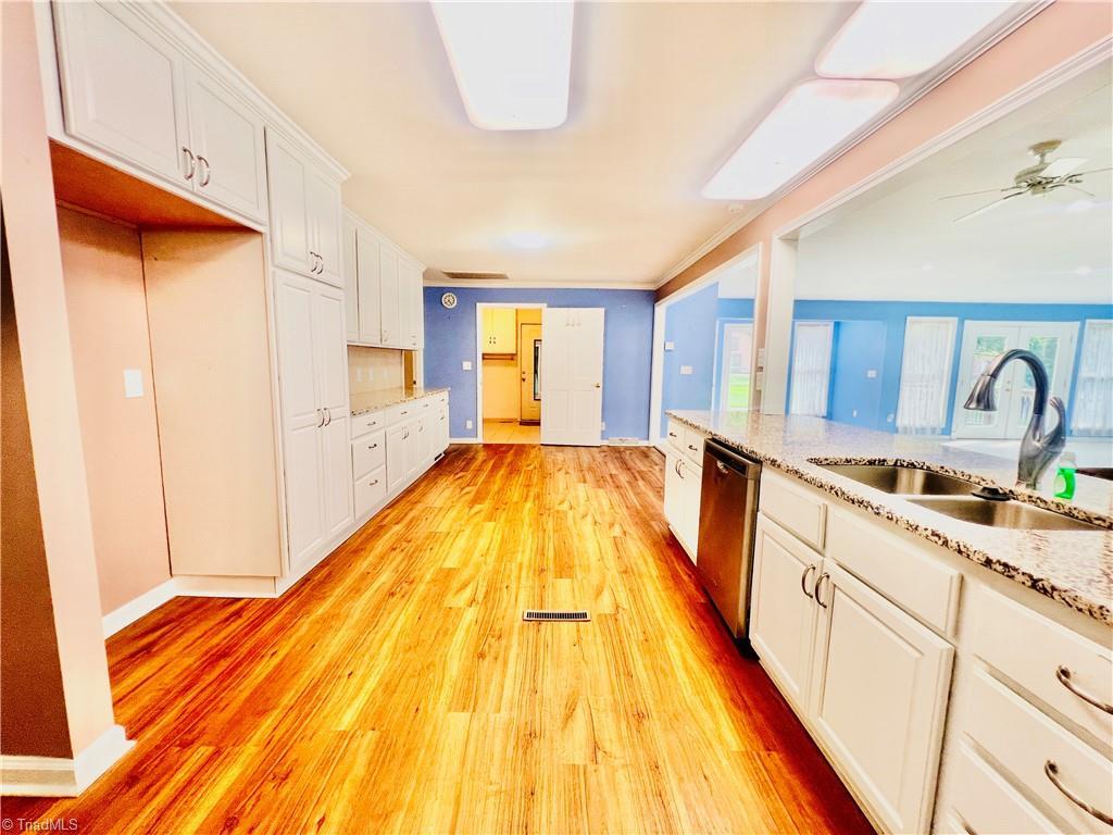 Image 4: Kitchen from stove toward laundry & bath room
