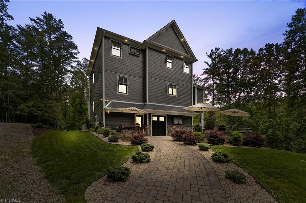 Image 4: Night View of Back of Home