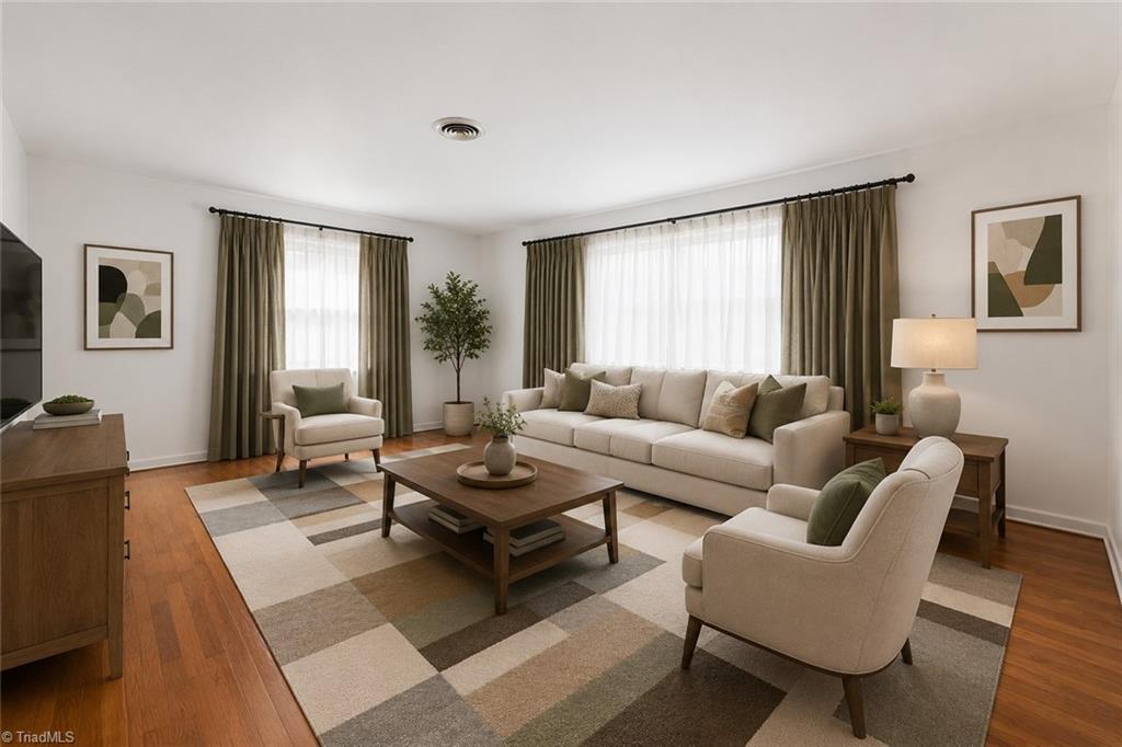 Image 3: Digitally enhanced. Living room with plenty of natural light.