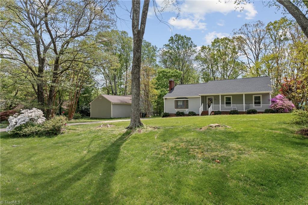Image 2: Large front yard with equally large rocker front porch to admire it from!