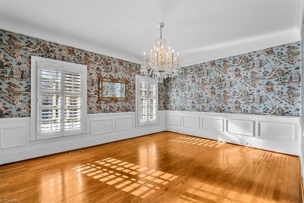 Image 4: Large dining room with beautiful natural light, plantation shutters