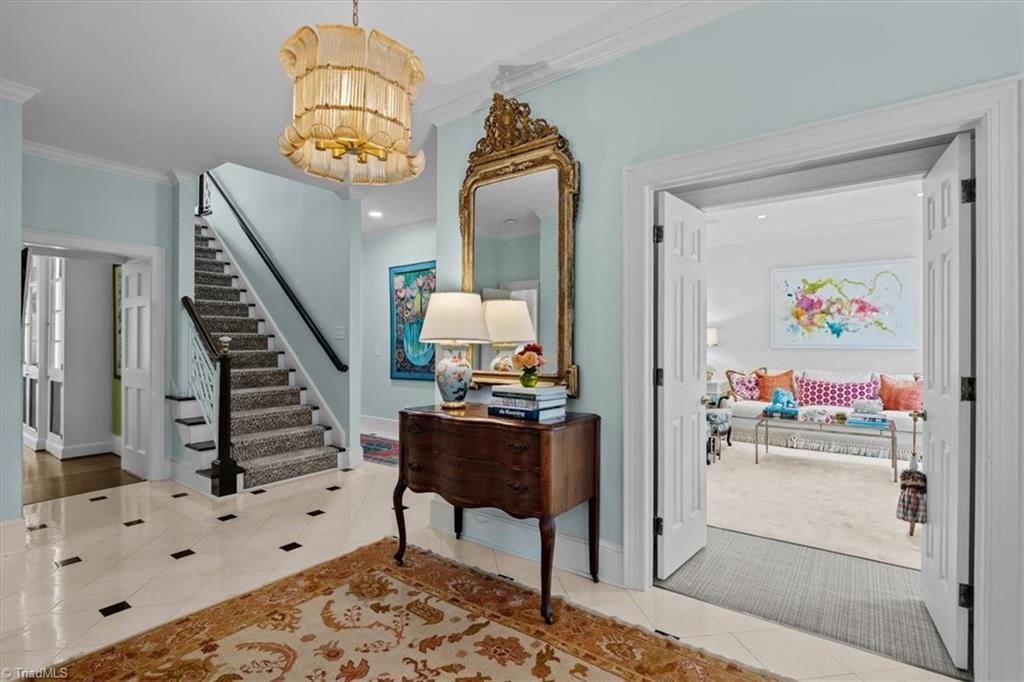 Image 4: Beautiful entry with black and white tile flooring