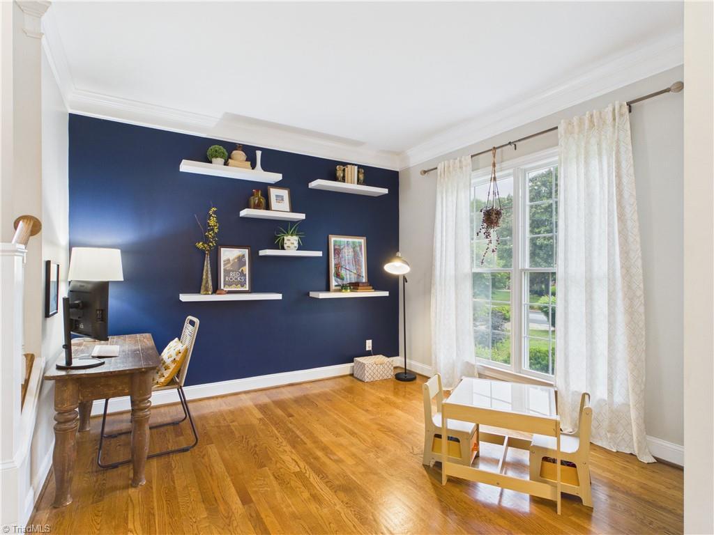 Image 1: Great living room just off the front door to entertain, or just relax.