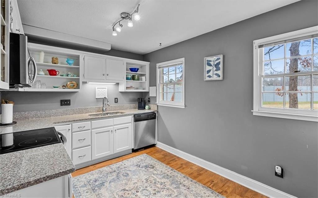 Image 4: Sunny Kitchen with natural light on front of townhome