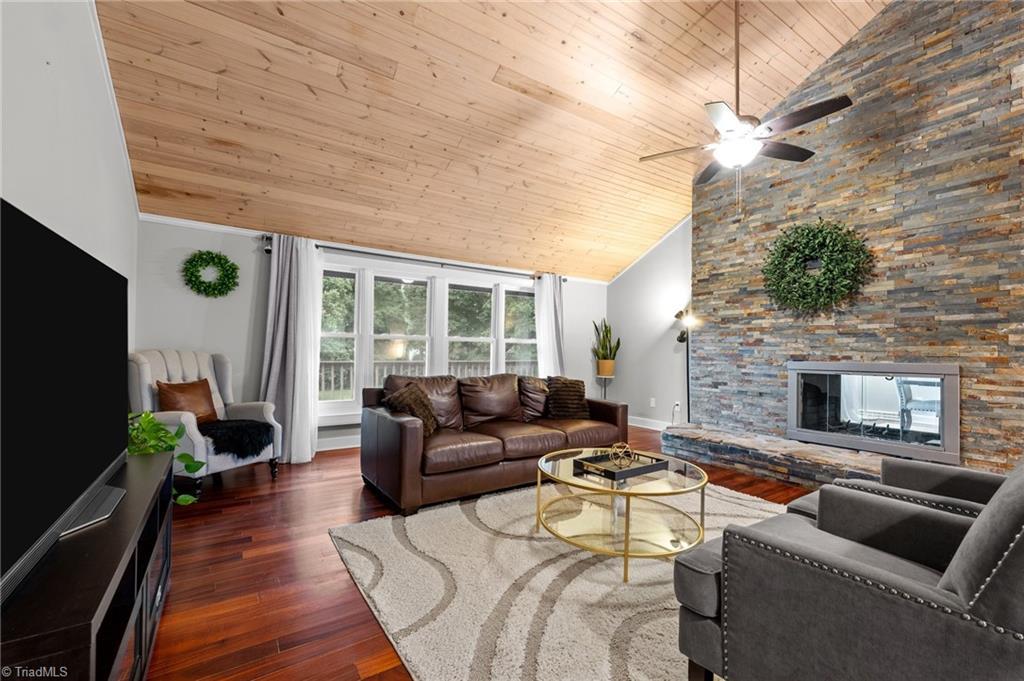 Image 4: TWO SIDED-FIREPLACE IN GREAT ROOM AND TONGUE-AND-GROOVED WOOD VAULTED CEILINGS