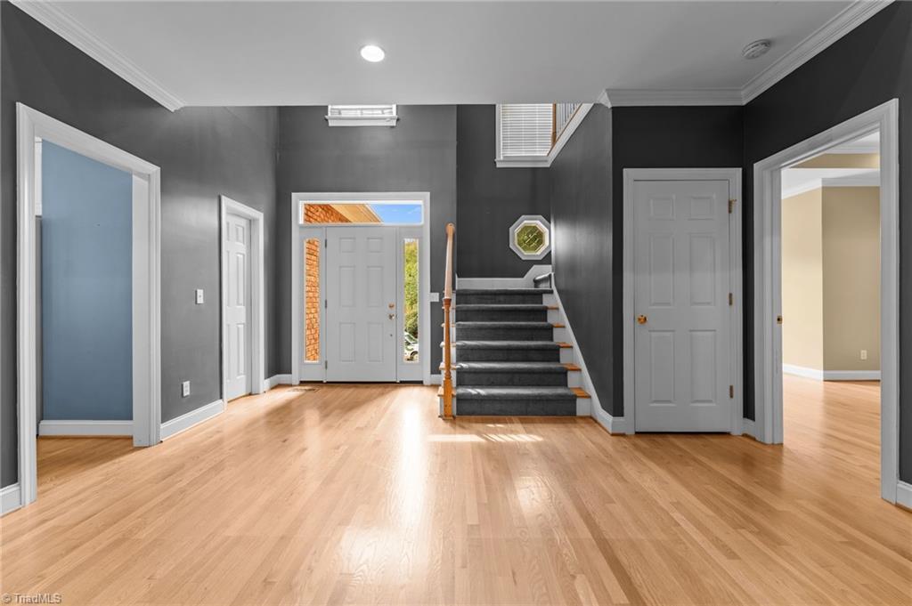 Image 4: Front entry and stairs to 2nd fl