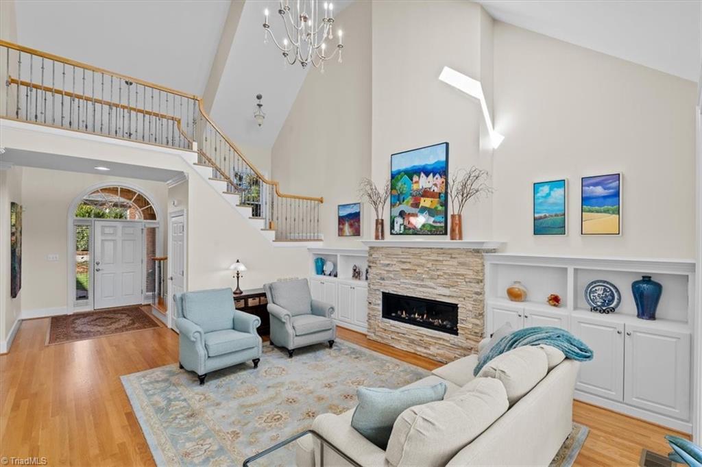 Image 4: The striking cathedral ceiling adds SO  much to this space!