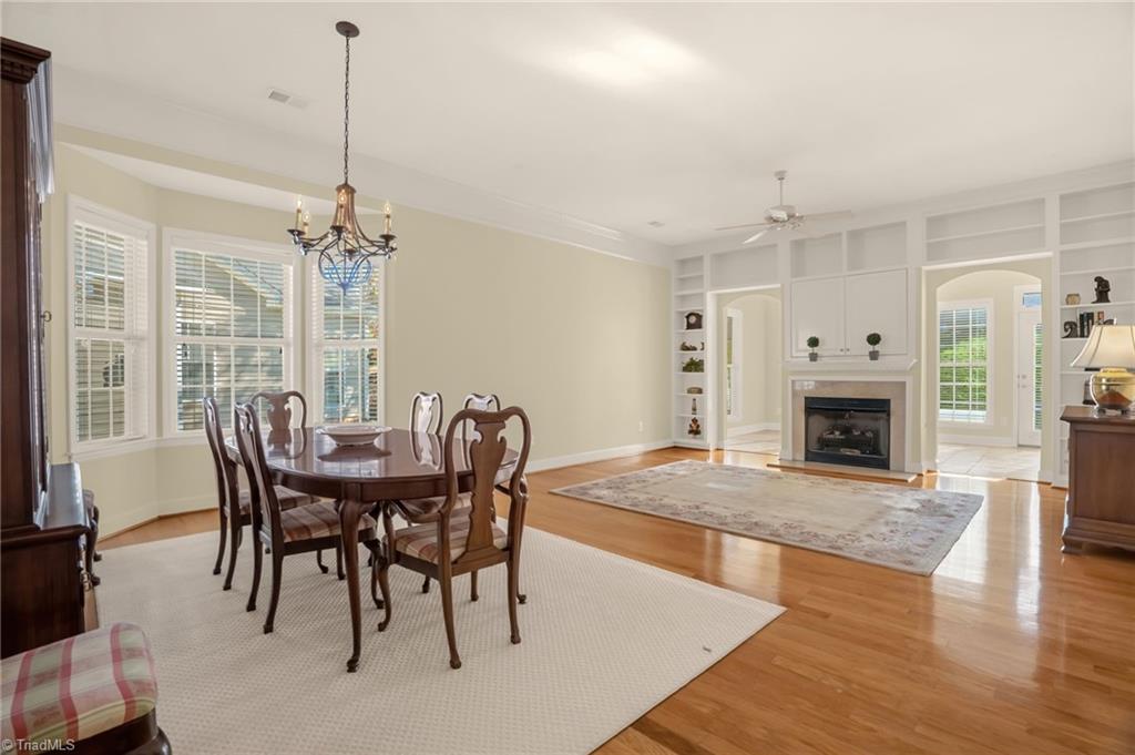 Image 3: Open living room/dining room concept.