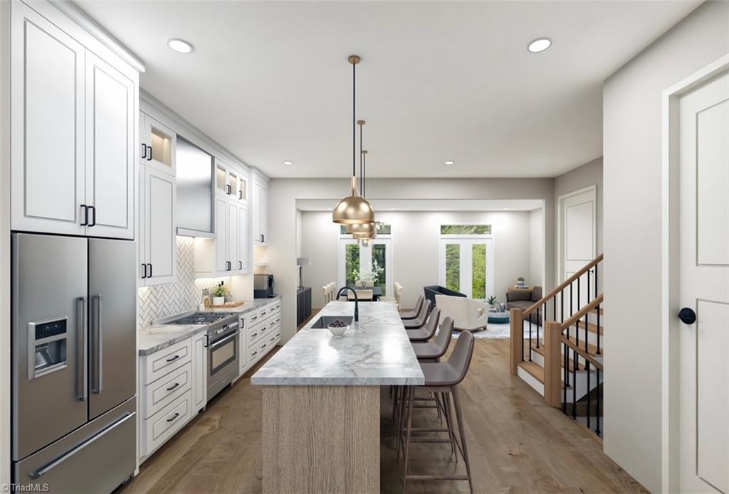 Image 2: Rendering Of Kitchen And Dining Room As Homes Are Under Construction