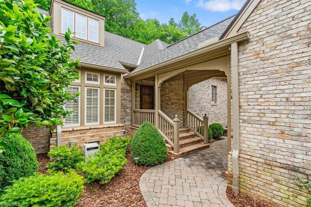 Image 1: 30 Sturbridge Lane has charming walkway to front entrance.