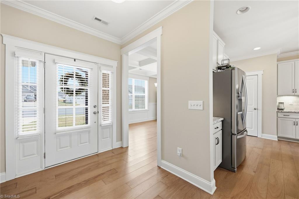Image 4: Front entry - dining room & kitchen