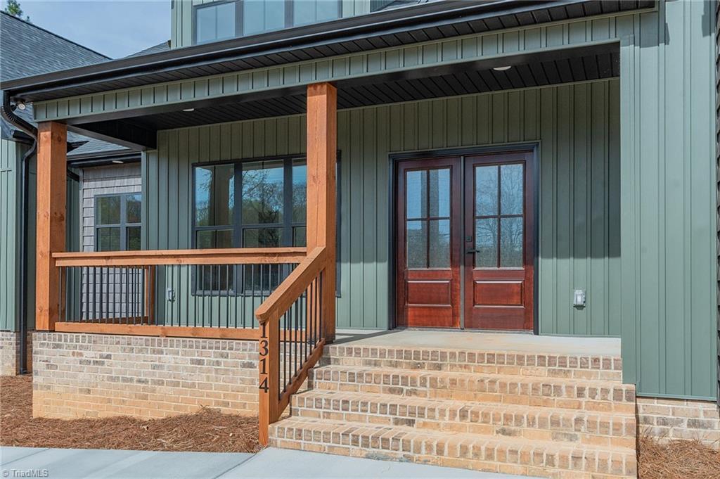 Image 3: Stained wood with black railings, View of High Rock Lake