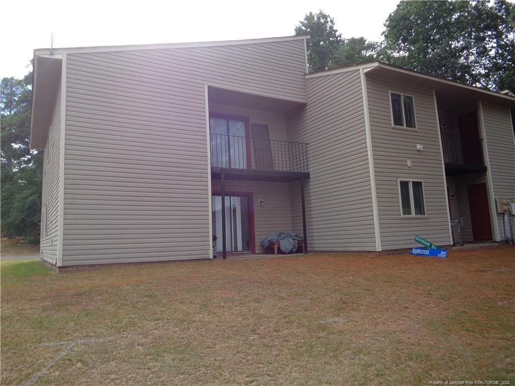 Image 3: BACK OF THE BULDING,PATIO FOR UNIT #4