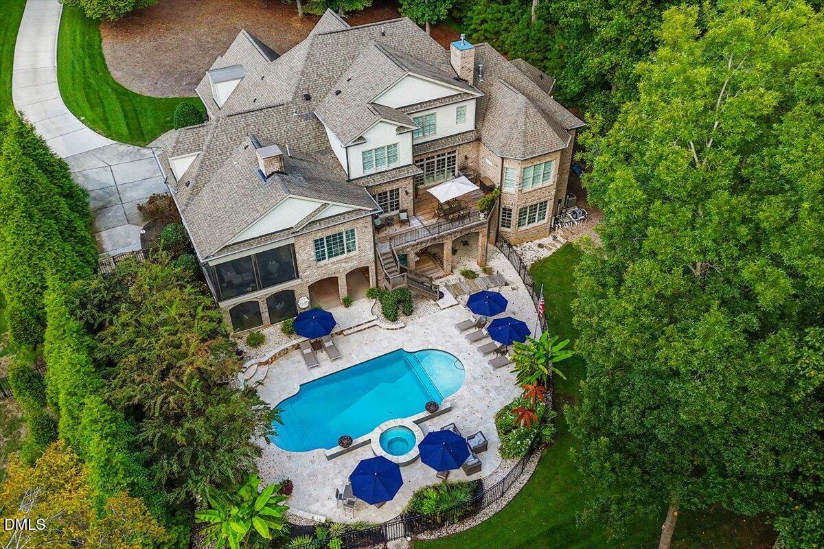 Image 4: Aerial View of Back of Home and Pool