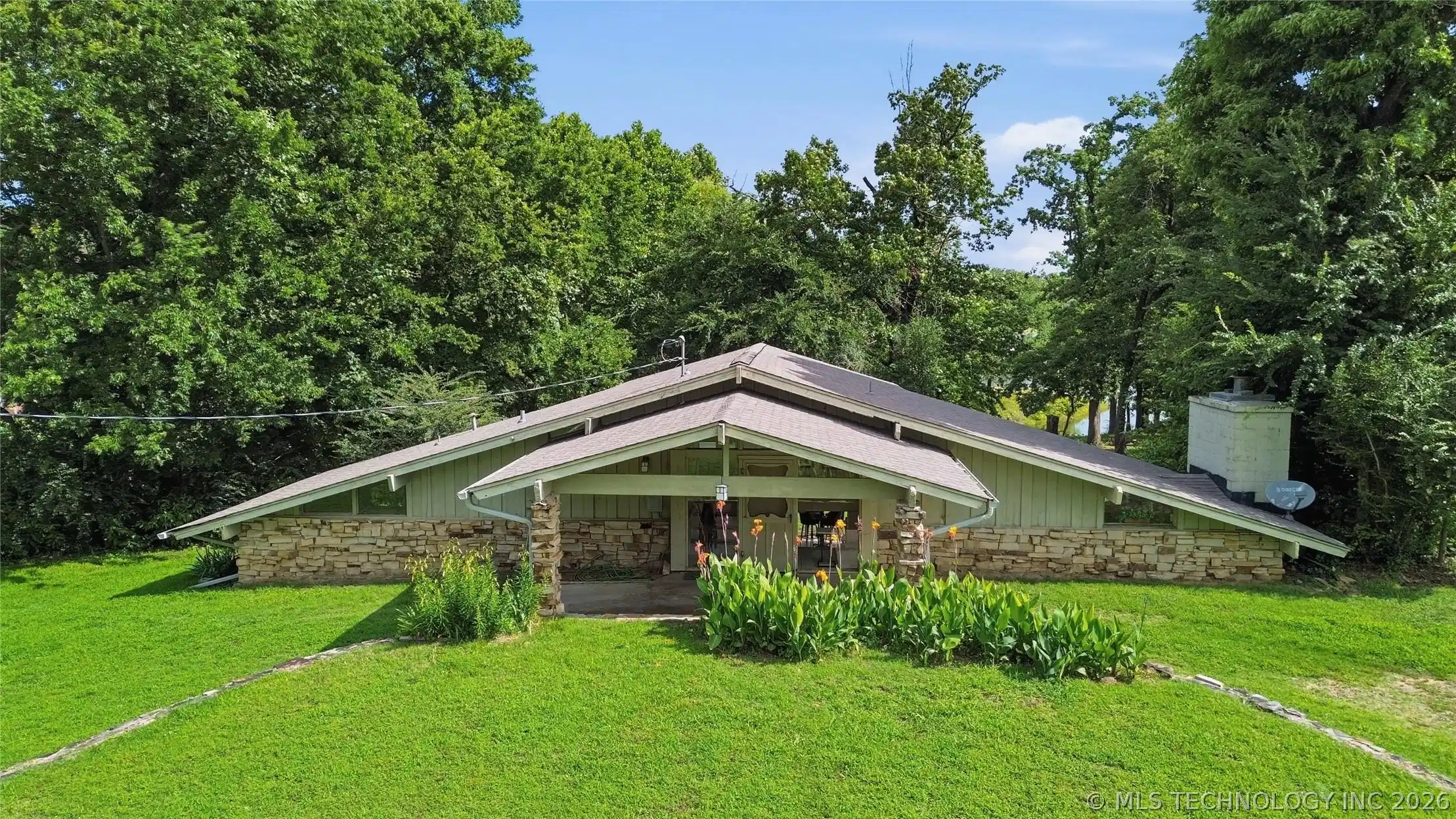 Image 1: This waterfront home offers great views of the lak
