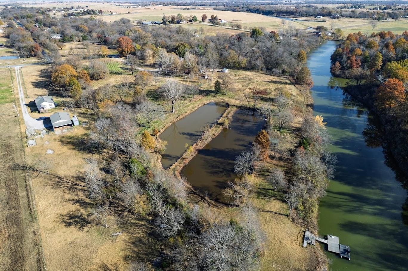 Image 3: Riverfront property featuring a private dock, two