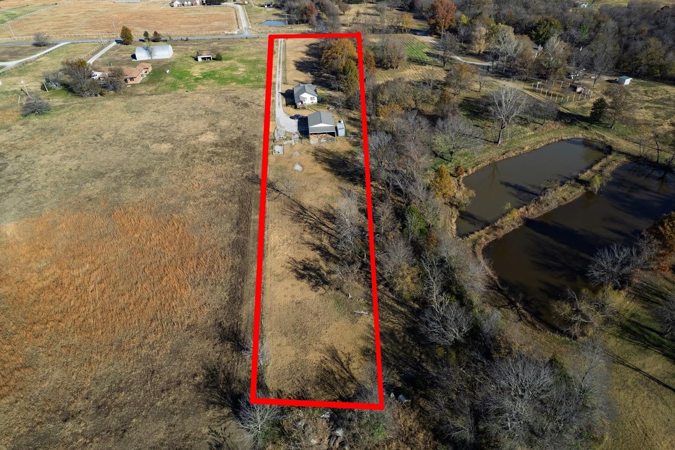 Image 4: Expansive land lot featuring a single-family resid