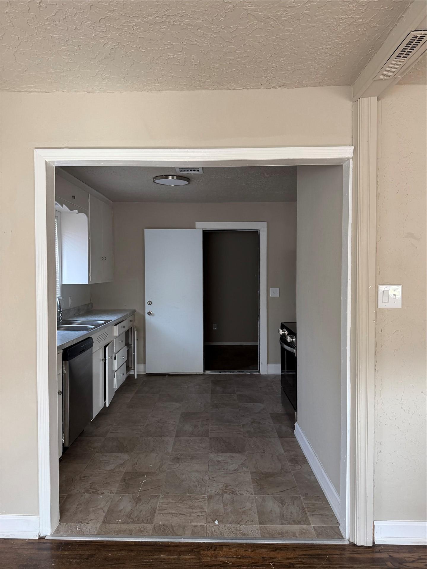 Image 3: Kitchen featuring square tile-pattern flooring, wh