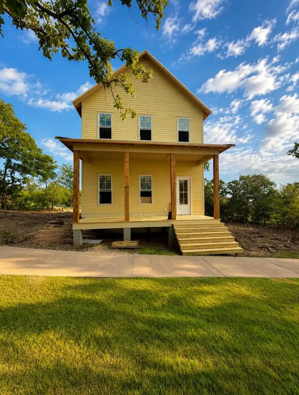 Image 1: Two-story residence featuring a covered front porc