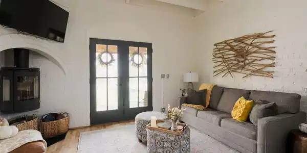 Image 4: Open-concept living space with exposed beam ceilin