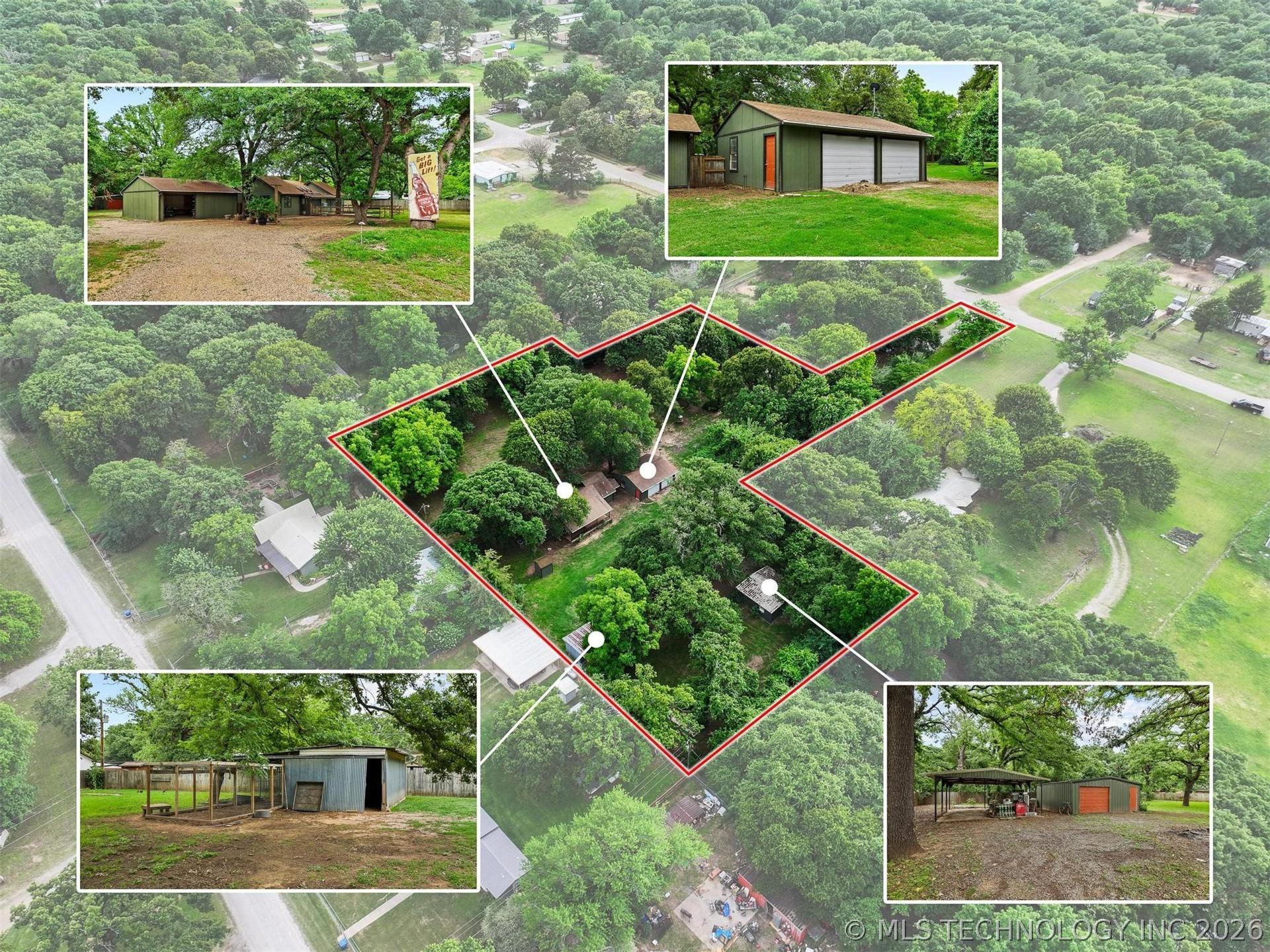Image 2: Aerial view showcasing a treed property with multi