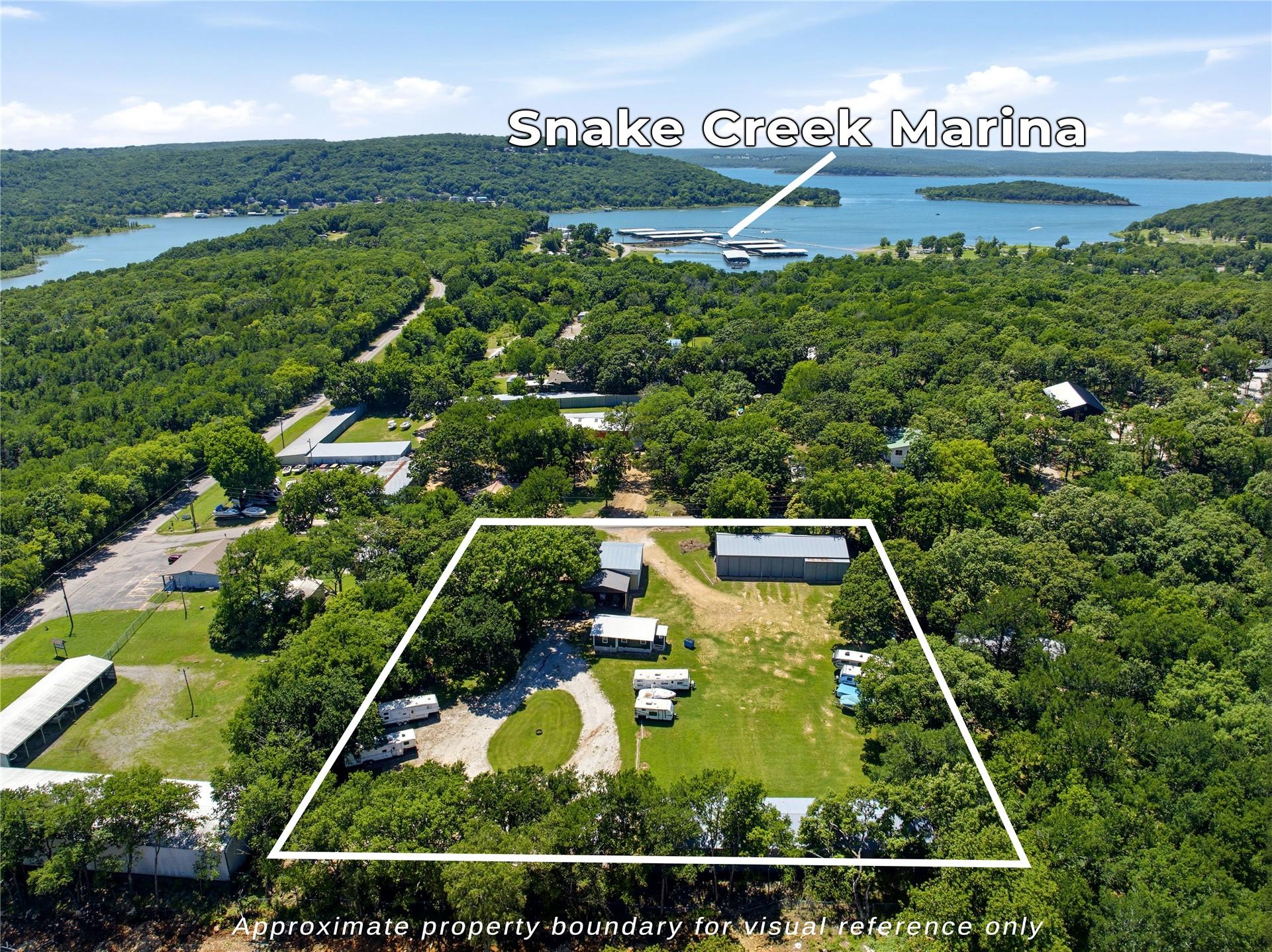 Image 1: Expansive multi-acre property nestled within matur