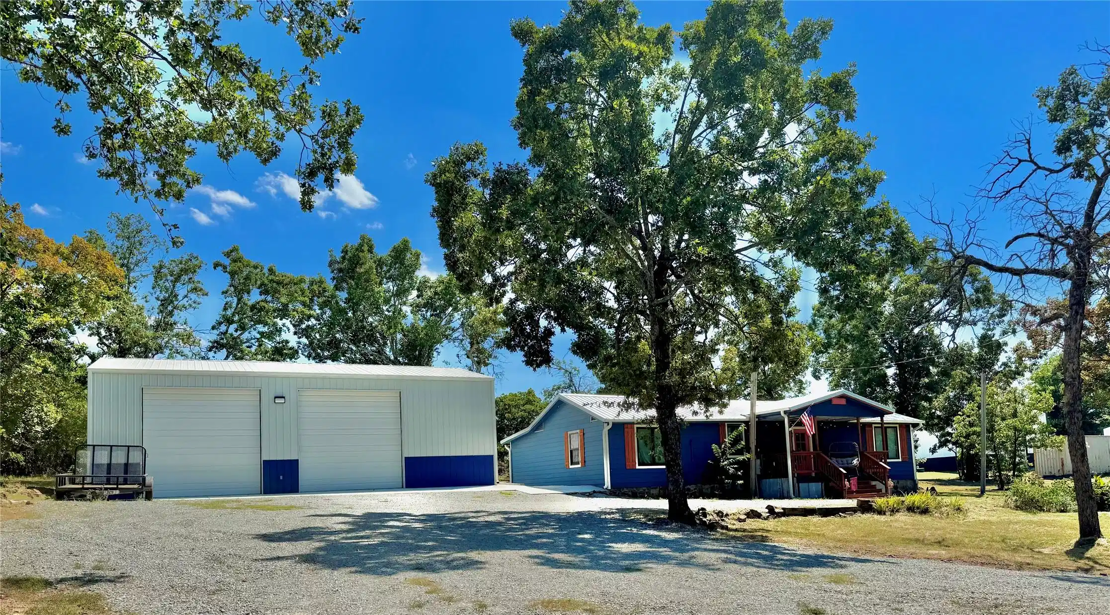 Image 1: Property features a large metal workshop building