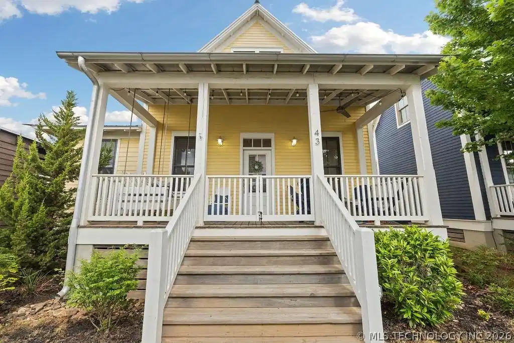 Image 1: View of exterior entry with a porch