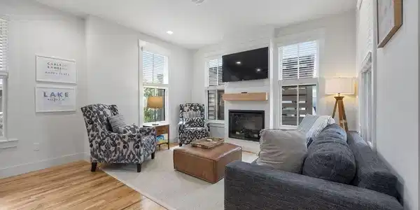 Image 2: Living room with a fireplace, light wood finished